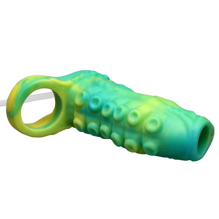 The Siphon Green Tentacle Squirting Penis Enhancer features a textured green and yellow sleeve with raised bumps, a circular handle on one end, and an opening on the other for enhanced play.