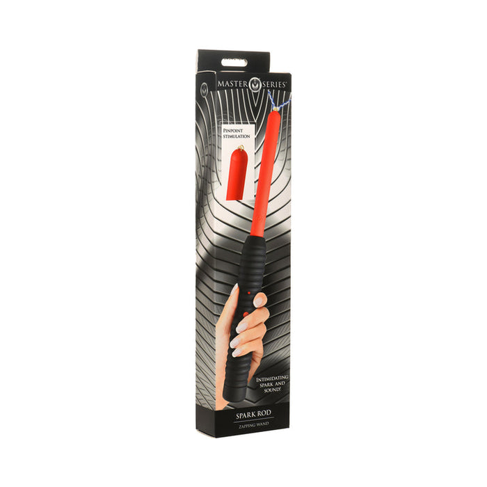 A boxed "Spark Rod Electro Stimulation Zapping Wand" by Master Series is shown, with its black and red electrosex toy held in hand, alongside visible product details and branding on the packaging.