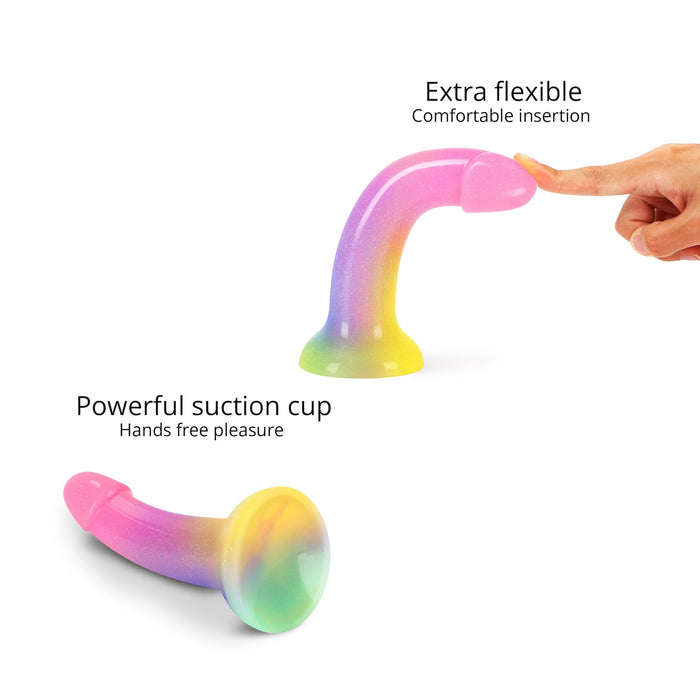 The Stargazer Smooth 7 Inch Rainbow Ombre Glitter Silicone Dildo with Suction Cup flexes easily for comfortable insertion, features a powerful suction base for hands-free fun, and is perfect for g-spot play.