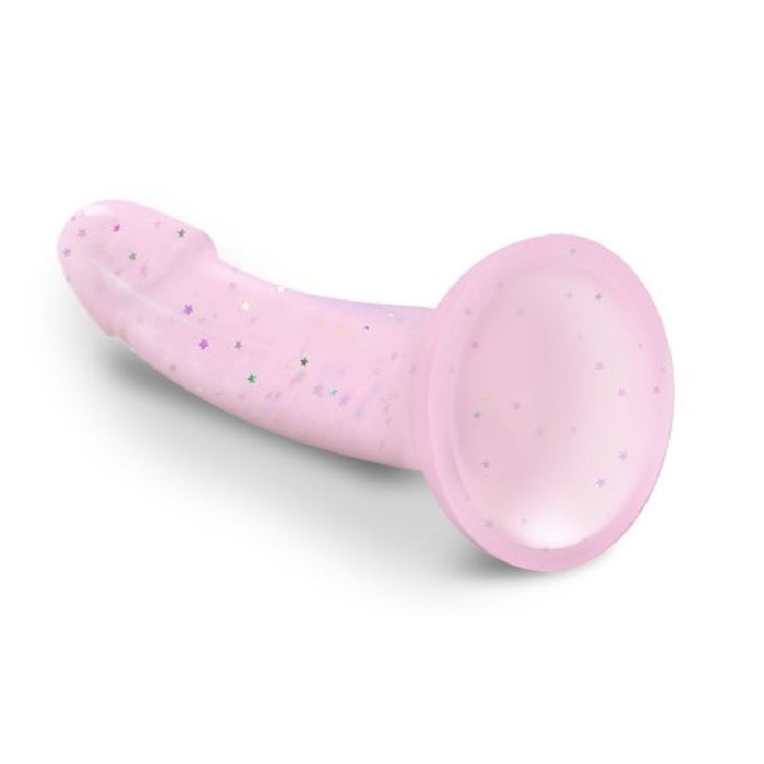 The Starlight Smooth 7 Inch Pink Glitter Silicone Dildo features a light pink, glittery finish, a flared suction cup base, and a gently curved shaft decorated with small star-shaped sparkles.