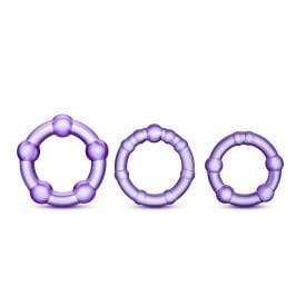 Three purple beaded rings, each with a unique design of connected spheres and rods, are arranged side by side on a white background. These items are part of The Ultimate Stroke & Relax Bundle.