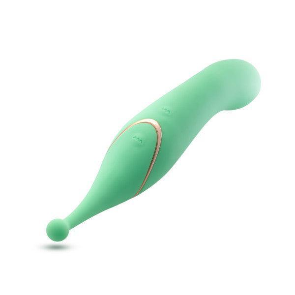 The Stella Double Ended G-Spot & Clitoral Vibrator is a green silicone massager with a rounded tip, curved design for precise stimulation, and gold side accents. Its smooth, modern look stands out against a white background.