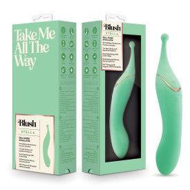 A mint green "Stella Double Ended G-Spot & Clitoral Vibrator" by Blush is displayed beside its tall box, which shares product details and the phrase “Take Me All The Way” in bold white text.