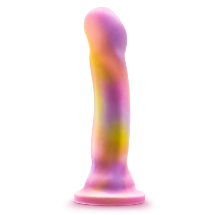 The Sun's Out 7.5 Inch Pink Ombre Silicone G Spot Dildo features a suction base and smooth, curved design with a rounded tip, plus a marbled pastel pattern in pink, purple, and yellow for stylish targeted pleasure.