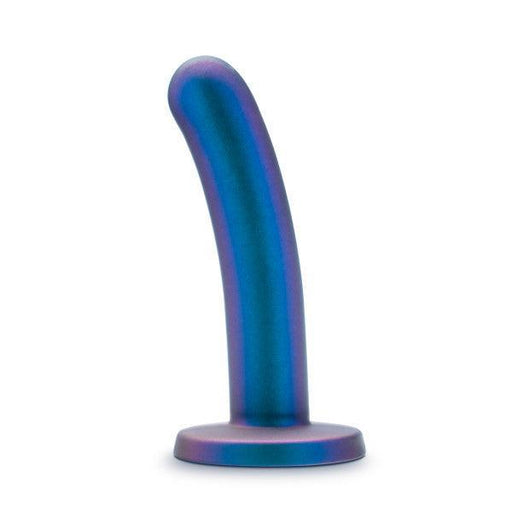 The Surrender Sleek Slim 5.75 Inch Blue Silicone Beginner & Pegging Dildo, featuring a curved, metallic blue and purple design with a rounded tip and flat circular base, stands upright against a white background—perfect for anal play or pegging.