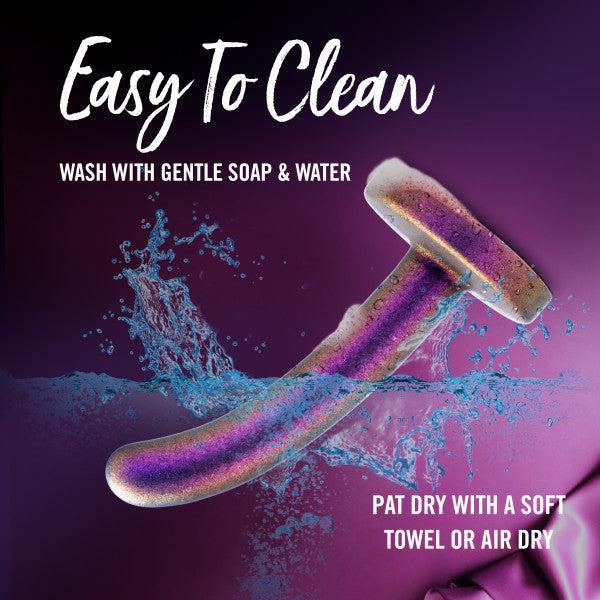 The Surrender Small 4.75 Inch Purple Silicone Beginner & Pegging Dildo is easy to clean—just wash with gentle soap & water, then pat dry or air dry. Sparkly, curved, and perfect for safe and fun play!.