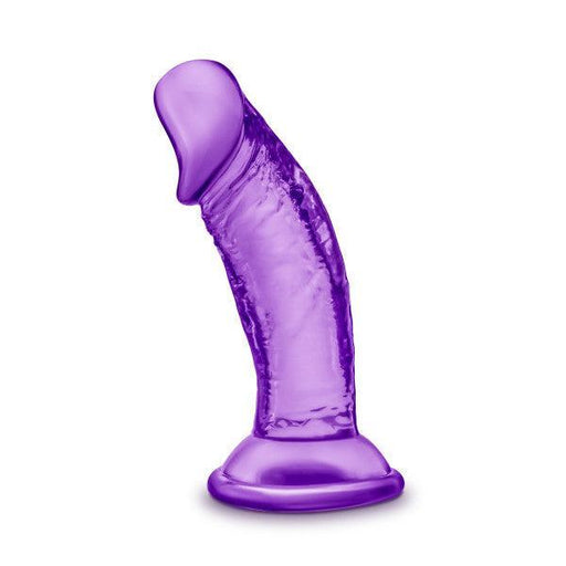 The Sweet n Small Slim 4 Inch Purple Dildo with Suction Cup features a curved, textured, translucent silicone shaft and flat base. Shown upright on a white background, this small dildo is strap-on compatible for versatile use.