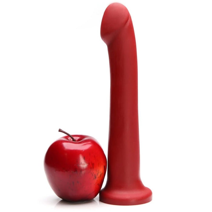 A shiny red apple sits next to the Tantus Hook Long 9 Inch G-Spot or Prostate Red Silicone Dildo—strap-on harness compatible—standing upright on a white background.