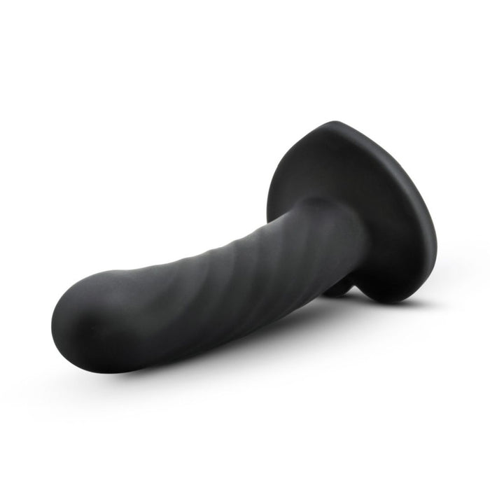 The Temptasia Twist Curved Slim 5 Inch Black Silicone Pegging Dildo, beginner-friendly with a flared base and curved shaft for strap-on compatibility, is displayed on a white background.