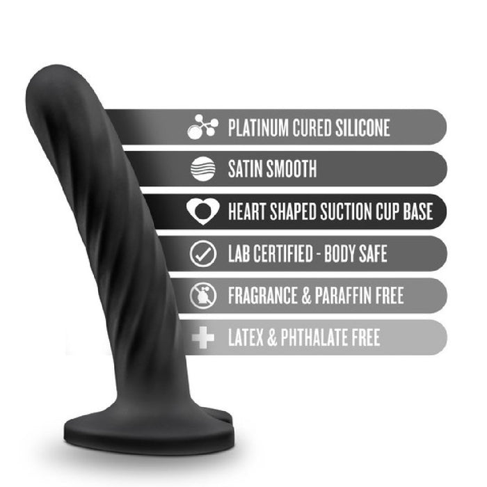 The Temptasia Twist Curved Slim 5 Inch Black Silicone Pegging Dildo features platinum cured silicone, a textured curved design, satin smooth finish, heart suction base, is strap-on compatible, body safe, latex free—perfect for beginners.
