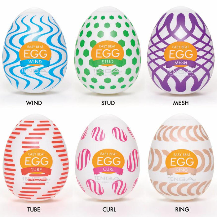 The Tenga Egg Disposable Penis Masturbation Sleeves - Wonder Variety Pack of 6 features egg-shaped toys with colorful WIND (blue waves), STUD (green hexagons), MESH, TUBE, CURL, and RING patterns for fun pleasure on the go.