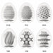The Tenga Egg Disposable Penis Masturbation Sleeves - Wonder Variety Pack of 6 includes uniquely textured, discreet white sleeves labeled WIND, STUD, MESH, TUBE, CURL, and RING—perfect for travel pleasure.