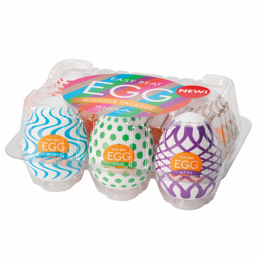 The Tenga Egg Disposable Penis Masturbation Sleeves - Wonder Variety Pack of 6 includes six uniquely patterned, colorful sleeves in a clear carton, perfect for fun, discreet travel use and convenient single-use pleasure.