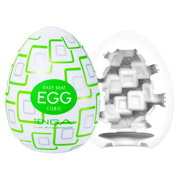 A white, egg-shaped object with a green geometric pattern labeled "Tenga Egg Disposable Penis Masturbator - Cubic" is shown next to a cut-open view that displays its textured interior.
