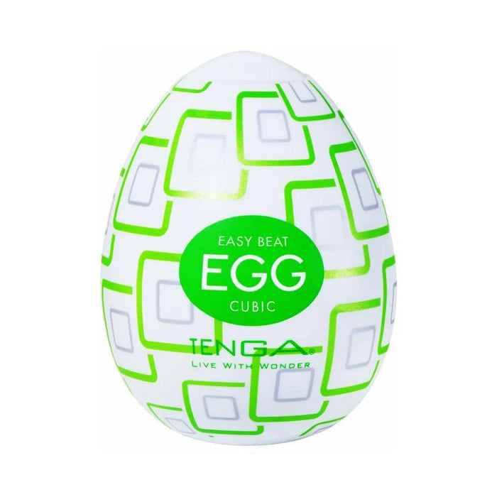 The Tenga Egg Disposable Penis Masturbator - Cubic is a white, egg-shaped travel sex toy featuring a green geometric pattern and discreet design for single-use pleasure.