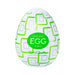 The Tenga Egg Disposable Penis Masturbator - Cubic is a white, egg-shaped travel sex toy featuring a green geometric pattern and discreet design for single-use pleasure.