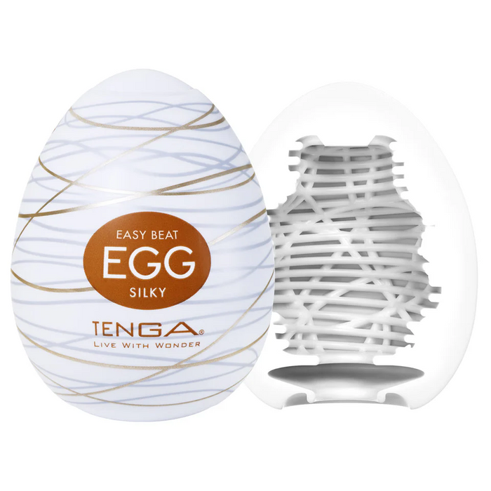 The Tenga Egg Disposable Penis Masturbator - Silky is a white, egg-shaped sleeve with a soft, wavy-textured interior—ideal as a travel-friendly disposable masturbation toy.