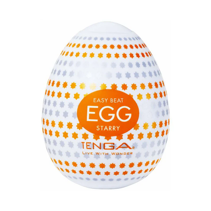 The Tenga Egg Disposable Penis Masturbator - Starry is a white, egg-shaped sleeve with orange and gray star designs, offering a discreet, travel-friendly and disposable option for solo pleasure.