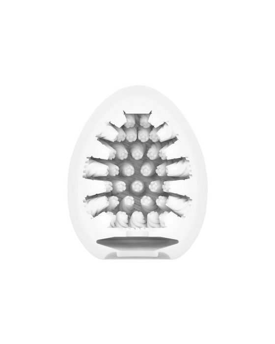 An x-ray image of a Tenga Egg Disposable Penis Masturbator - Cone cut in half, revealing the intricate arrangement of super stretchable elastomer seeds inside.