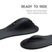 Close-up of the sleek, black silicone Cowgirl Rodeo Rumbler Grinding Sex Machine with raised features, clitoral tapper, and vibrating hump. Text above: "READY TO RIDE. Rideable pleasure machine for hands-free stimulation.
