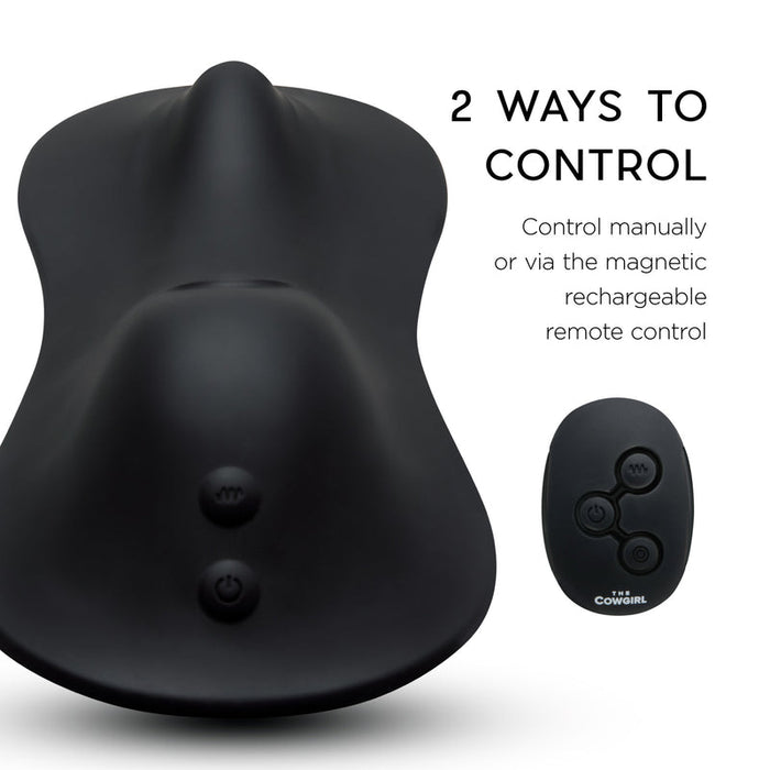 A black ergonomic device and matching black remote are shown. Text: "Control The Cowgirl Rodeo Rumbler Grinding Sex Machine manually or with the magnetic rechargeable remote for hands-free stimulation.