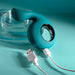 Teal silicone shallow penetration vibrator with a finger loop and magnetic USB charging cable.