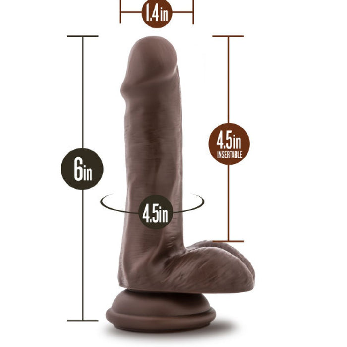 The Top Gun Tommy Lifelike 6 Inch Dark Tone Dildo with Suction Cup stands upright, is harness compatible, and features a 4.5" insertable length, 1.4" width, and 4.5" circumference for realistic pleasure.