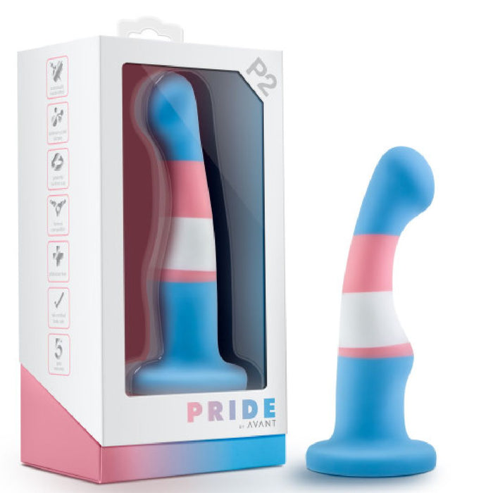 The Trans Pride Slim Curved 6 Inch Silicone Suction Cup Dildo features blue, pink, and white trans flag colors and a curved tip, with "PRIDE by AVANT" branding on the box. Made from platinum cured silicone for quality and pride.