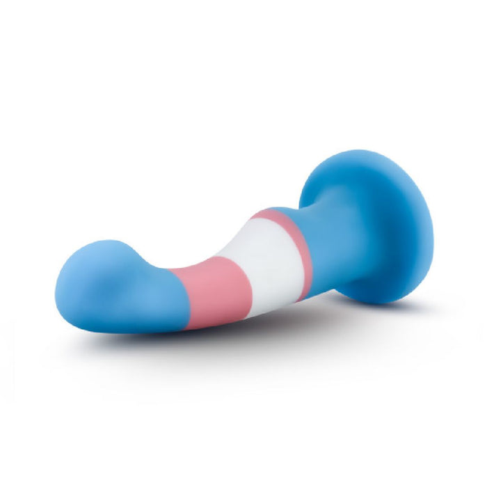 The Trans Pride Slim Curved 6 Inch Silicone Suction Cup Dildo features blue, white, and pink colors, a flared base, curved shape, and smooth platinum-cured silicone surface, shown on a white background.