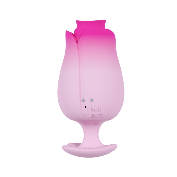 The Tulip Trance Licking Sucking Clitoral Vibrator is a silicone adult toy shaped like a pink rosebud with smooth curves and a stem-style base, delivering luxurious clitoral stimulation through licking and sucking sensations.