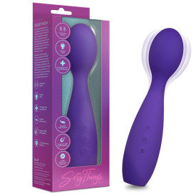 The Velvet High Versatile Internal or External Vibrator with Flexible Neck in purple silicone is shown beside its box, which includes product details and a clear window highlighting the clitoral stimulation device.