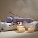 The Wand & Done Double Ended Ergonomic Silicone Wand Vibrator is a purple, rechargeable, body-safe silicone toy with a rounded head, curved handle, and front control buttons, shown against a white background.