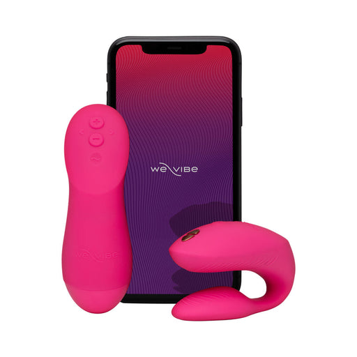Hot pink We-Vibe Chorus Pro wearable vibrator and haptic remote displayed in front of a smartphone with the app open.