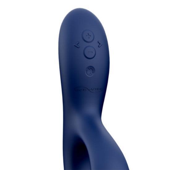 Close-up of the We-Vibe Nova 2 Powerful Flexible G-Spot Rabbit Vibrator in blue silicone, featuring four control buttons with plus, minus, and power symbols on its curved handle against a white background.