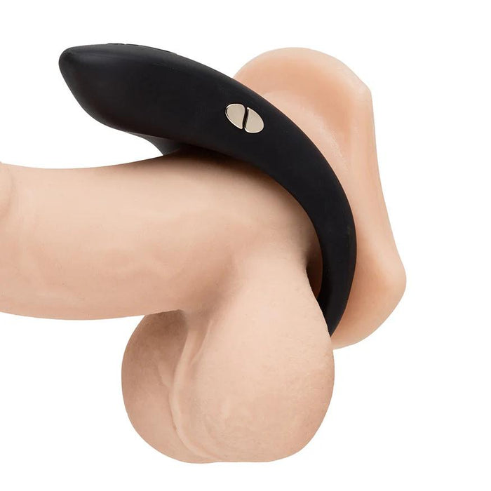 Black silicone We-Vibe Verge 2 vibrating cock ring worn on a skin-toned anatomical model for stimulation.