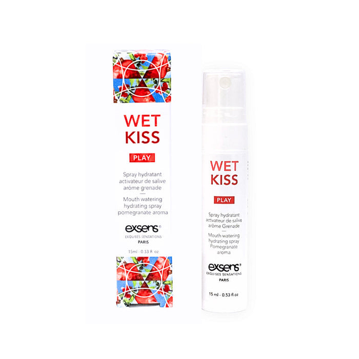 A bottle of Wet Kiss Pomegranate Moisturizing Saliva Spray sits beside its white packaging, which displays red text and images of pomegranates.