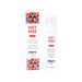 A bottle of Wet Kiss Pomegranate Moisturizing Saliva Spray sits beside its white packaging, which displays red text and images of pomegranates.