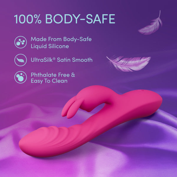 The Wild Lust Slim Beginner G-Spot Rabbit Vibrator is shown on purple satin with floating feathers, featuring body-safe liquid silicone, UltraSilk smooth texture, clitoral stimulation, phthalate-free design, and easy cleaning.
