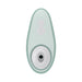 The Womanizer Liberty 2 Pleasure Air Travel Sized Clitoral Stimulator is a mint green, oval waterproof device with plus and minus buttons and a circular opening at one end, designed for clitoral pleasure air technology.