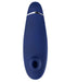 A blue, oval-shaped handheld device with a circular opening and silver accent near the top—this air pulsation stimulator is the Womanizer Premium 2 Pleasure Air Clitoral Stimulator.