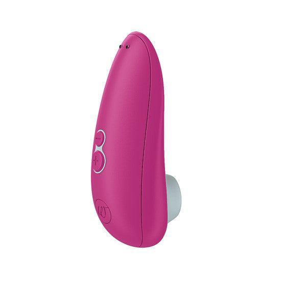 The Womanizer Starlet 3 Pleasure Air Clitoral Stimulator is a pink, handheld, oval-shaped device with side control buttons and a white circular opening at the tip, shown against a white background.