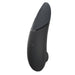 A sleek black handheld device with a curved design, front buttons, and a top power indicator—this is the Womanizer x We-Vibe Lust & Luxury Collection, featuring innovative Pleasure Air technology.