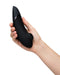 Caucasian hand holding Womanizer Next  Pleasure Air Clitoral Vibrator - Black