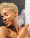 Womanizer Wave Water Pulsing Shower Masturbator (Chrome) with model in shower