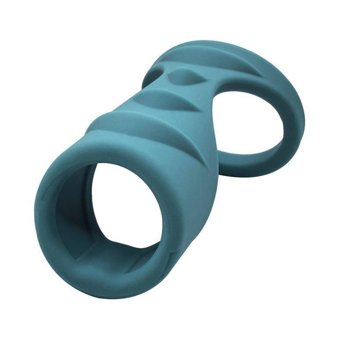 The Adam & Eve Ridged Cock Cage with Shaft Support is a teal, textured cock ring made of stretchy silicone with two circular openings and a contoured, ridged design, shown on a white background.