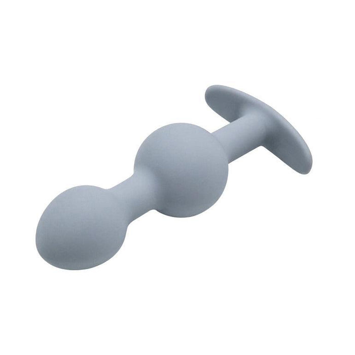 The Adam & Eve Vibra Ball Weighted Butt Plug Trio & Anal Trainers, shown on a plain white background, features gray silicone plugs with smooth rounded tips and flared bases—ideal for exploring anal toys or butt plug sets.