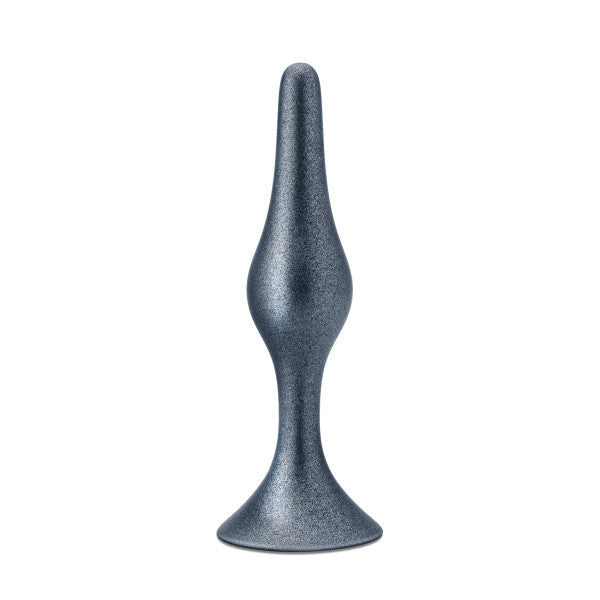 One of the three flexible butt plugs from the Blush Anal Adventures First Time Kit, featuring a smooth metallic grey finish and constructed from pure platinum cured silicone with a tapered design and a wide, flared base, is displayed standing upright against a white background.