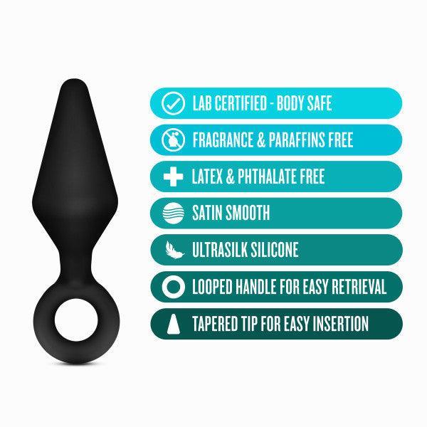 A black butt plug from the Anal Adventures Silicone Loop Anal Training Butt Plug Set by Blush is displayed alongside teal-colored labels detailing its features: lab certified, body-safe, fragrance & paraffins free, latex & phthalate free, satin smooth Ultrasilk silicone, easy retrieval handle, and tapered tip—an ideal addition to your silicone plug kit.