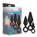 The Blush "Anal Adventures Silicone Loop Anal Training Butt Plug Set" is displayed as a boxed set of three black silicone anal plugs with finger-loop handles. The packaging showcases the body-safe, black tapered plugs in various sizes on the front of the box and emphasizes that they are made of 100% silicone.