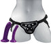 An Sportsheets anal explorer strap-on pegging harness kit with two silicone dildos, one purple and one pink, displayed on a white mannequin torso against a grey background.